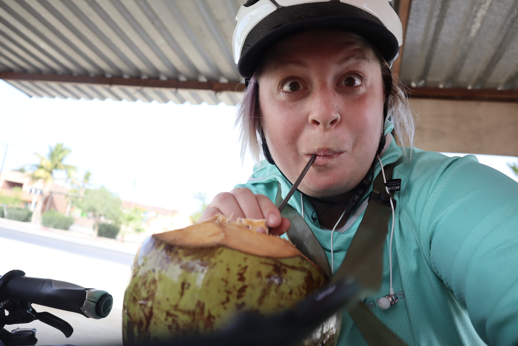 woman eating a coconut